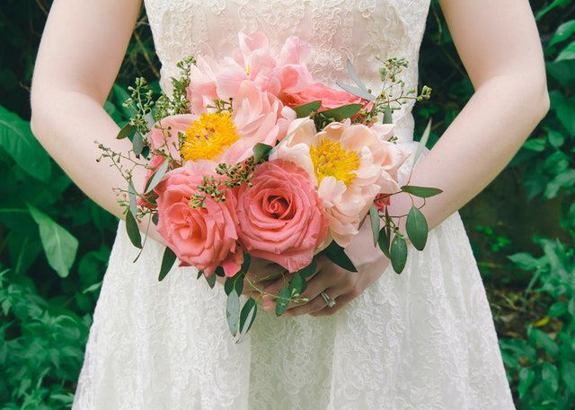 A bride holding wedding flowers