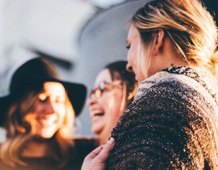 Three women chatting and laughing