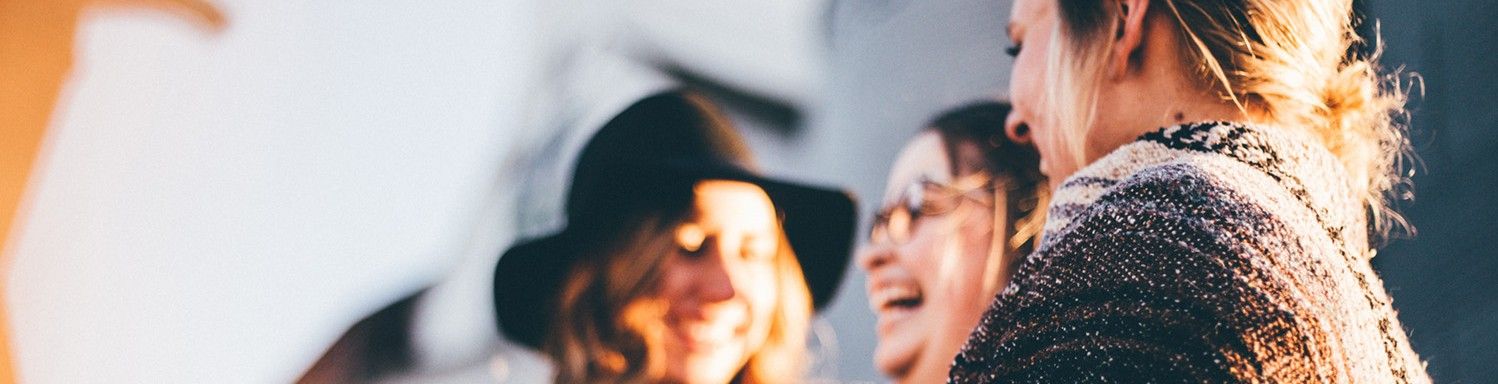 Three women chatting and laughing