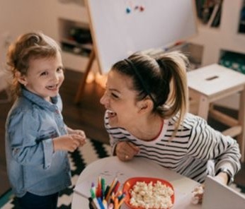 Mother and Daughter laughing 